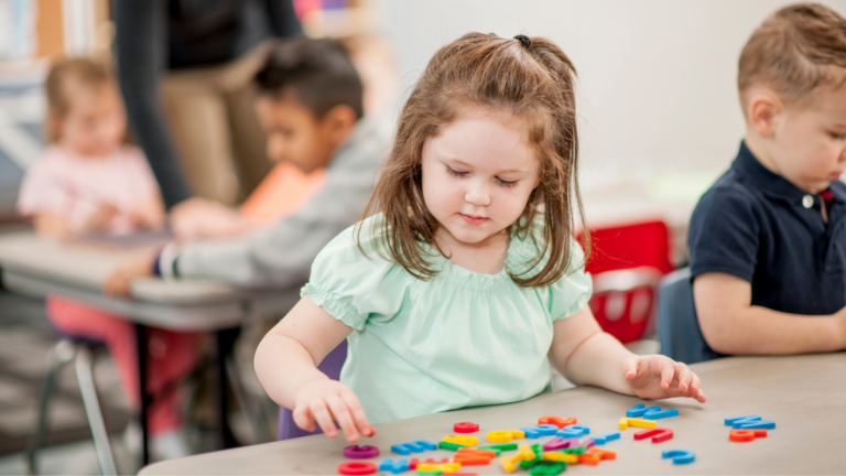 Girl using plastic letters